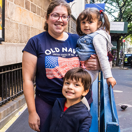 family standing on ramp smiling