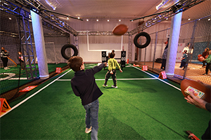 boy throwing football