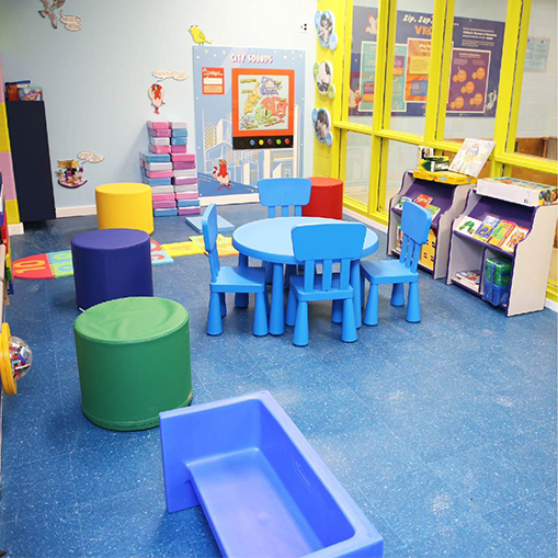 a children's classroom/playroom with vibrant colors