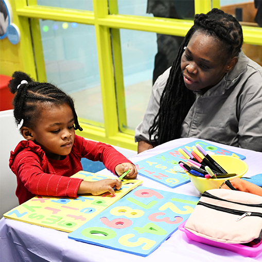 woman and child doing art
