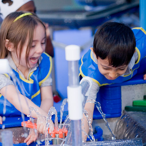 two children playing with water