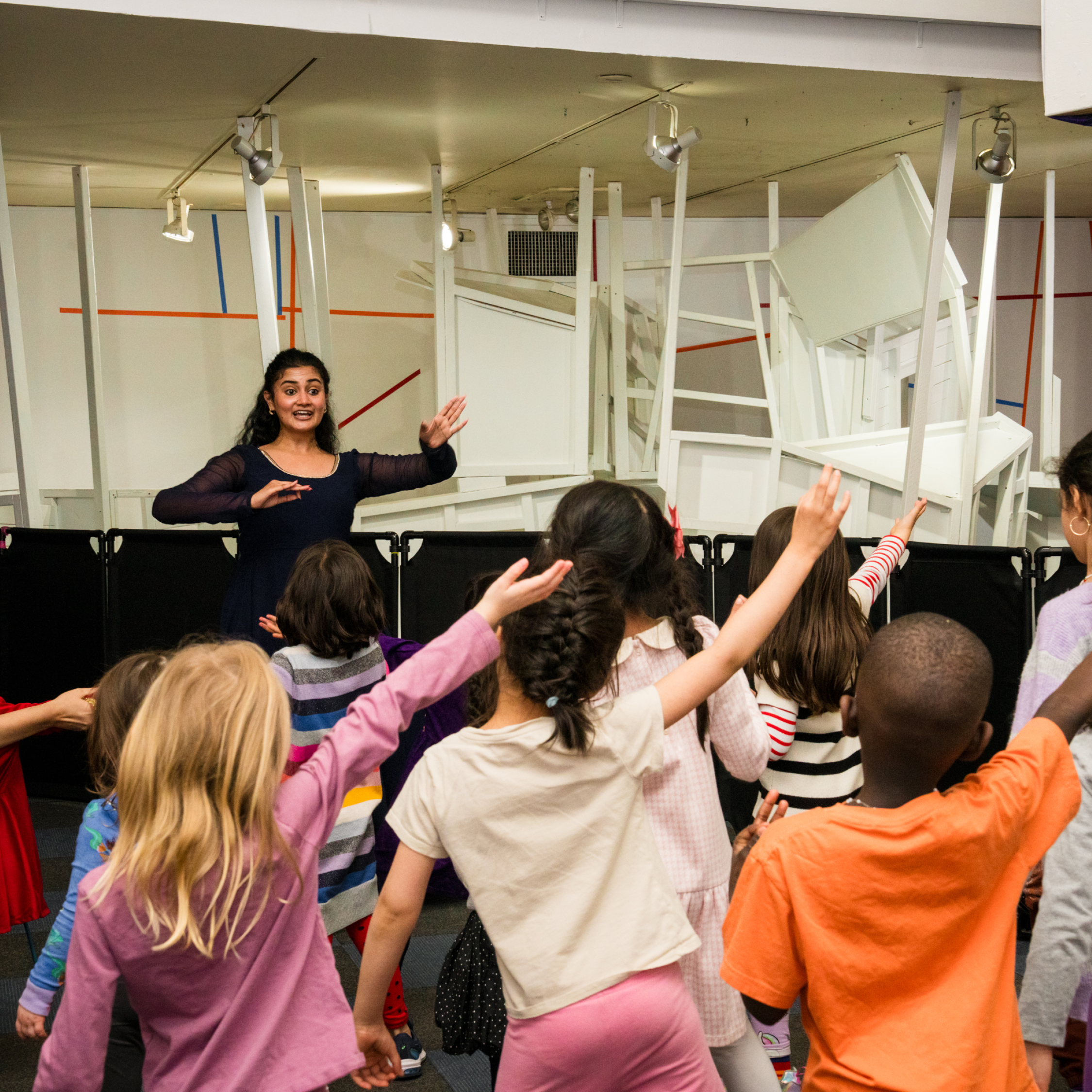 children dance along with an visiting artist