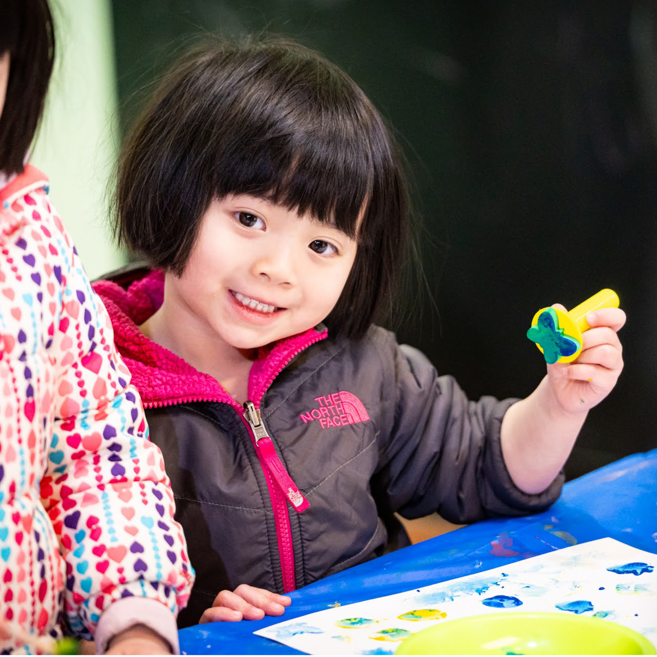 Child stamping an art project