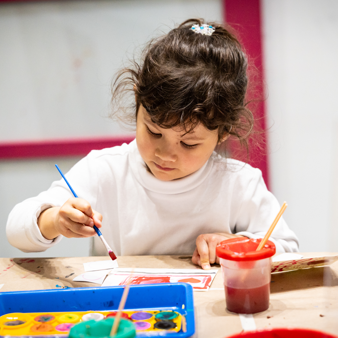 Child watercolors a card
